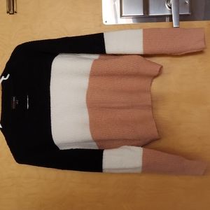 Sweater is by ambiance apparel in a size Large in black, white, and pink.